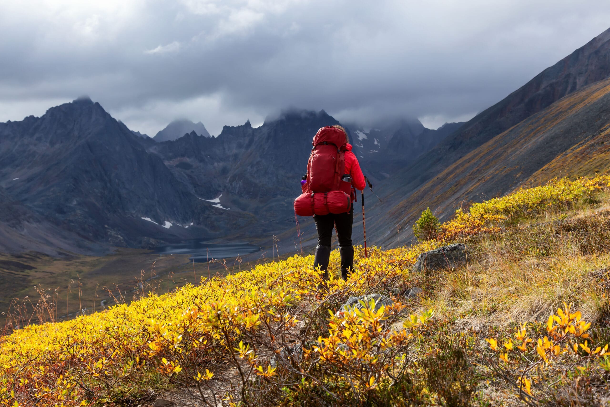 Woman Backpacking on Scenic Rocky Hiking Trail